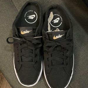 Black and White Nike Women’s Mules